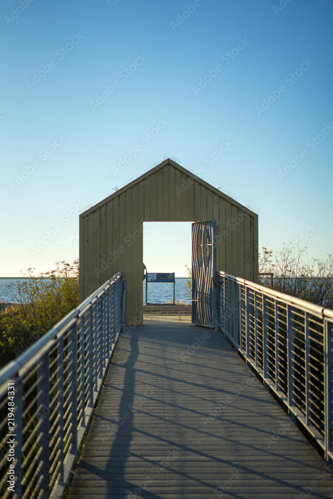 Obraz premium sunset in Alviso Marina County Park with door in there