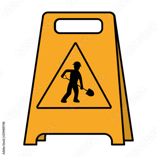 color plastic caution emblem and laborer with shovel