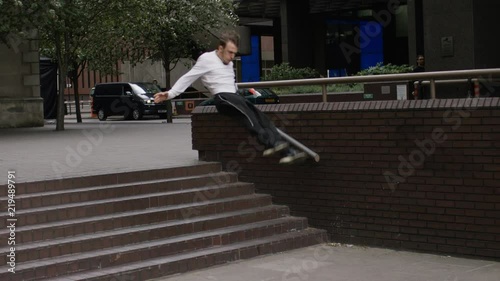 Young parkour athlete running and jumping in the city, in slow motion 