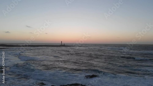 Wide aerial, scenic sunset over ocean