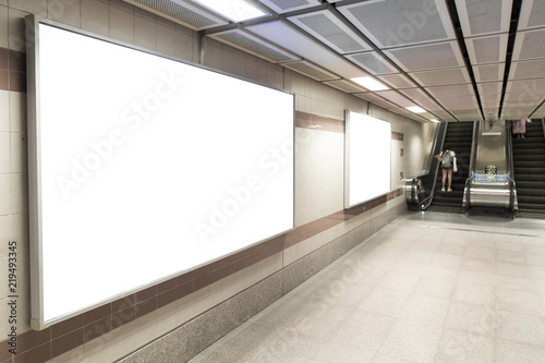 Blank billboard posters in the subway station for advertising.