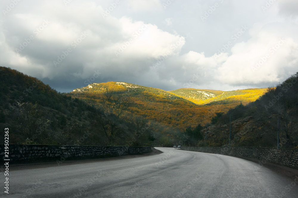 Asphalt road amonf autumnal mountains