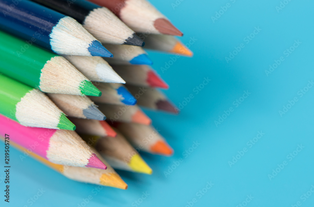 Color pencil with  space on blue background, Selective focus.