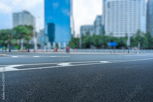 empty road and modern office block buildings against sky, china