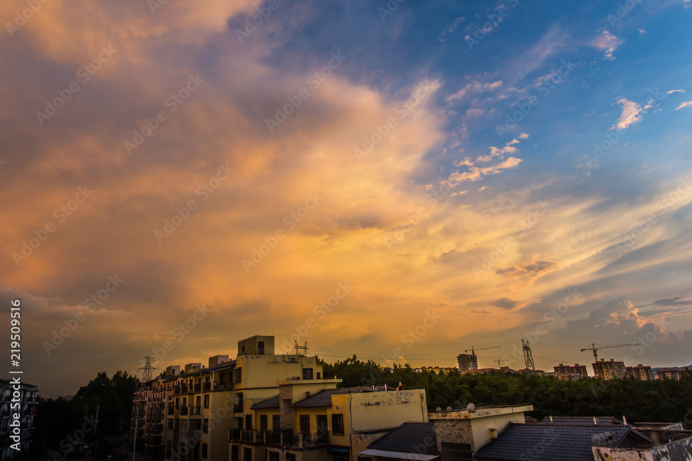 Peculiar beautiful sunset cloudscape and hilltop town in summer in Chongqing, China