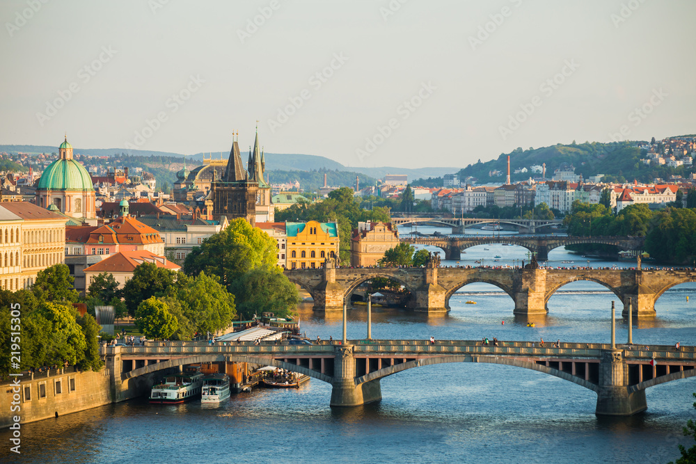 Scenic spring sunset aerial view of the Old Town pier architecture and Charles Bridge over Vltava river in Prague, Czech Republic