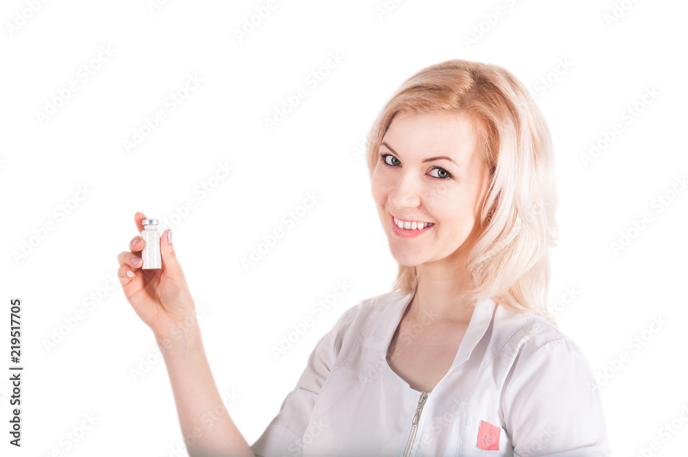 A female doctor in a white medical suit is holding ampoules for injections, a syringe for injections. Doctor isolated on white background with objects for injections A female doctor in a white medical suit is holding ampoules for injections, a syringe for injections. Doctor isolated on white background with objects for injections