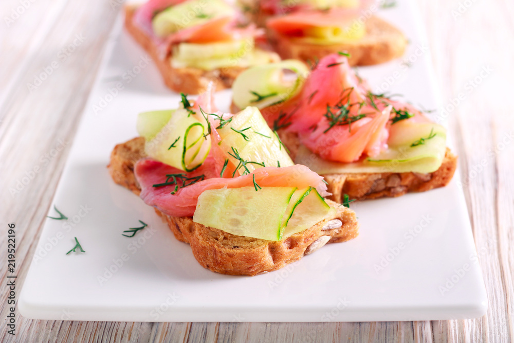 Salmon and cucumber over brown bread Salmon and cucumber over brown bread