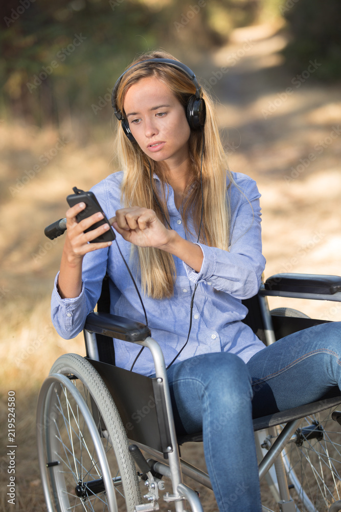 Fototapeta premium young woman in a wheelchair