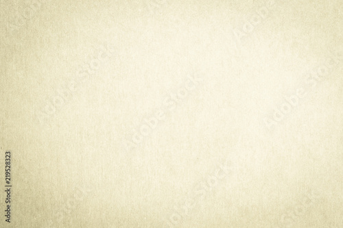 Recycled paper texture background in antique light yellow cream beige color