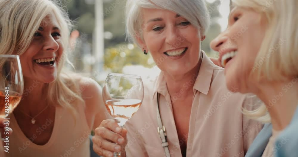 Happy mature friends having fun drinking wine at restaurant Happy mature friends having fun drinking wine at restaurant