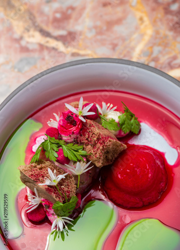 Fine dining, Elegant seabass tartare with beeroot ice cream photo