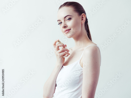 Perfume woman spray over white background