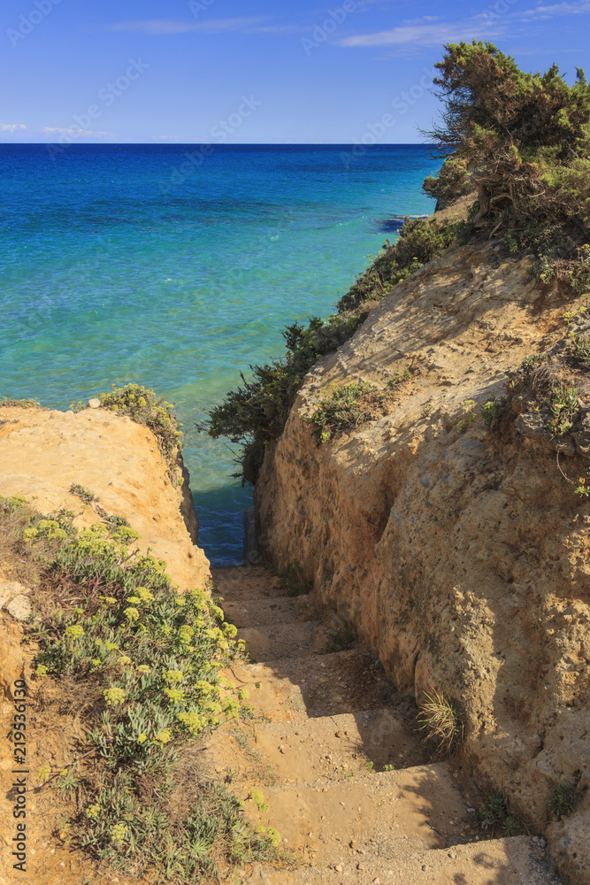 Stairway to the sea.The most beautiful coast of Apulia: Torre Sant' Andrea, Otranto ,ITALY (Lecce). Typical coastline of Salento: seascape with cliffs, rocky arch and sea stacks.