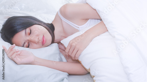 Asian young beautiful woman sleeping in her bed. She looking charming.