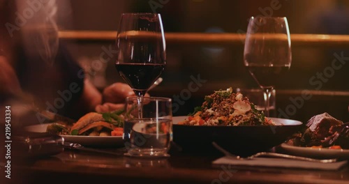 Man and woman eating gourmet dinner at fine dining restaurant