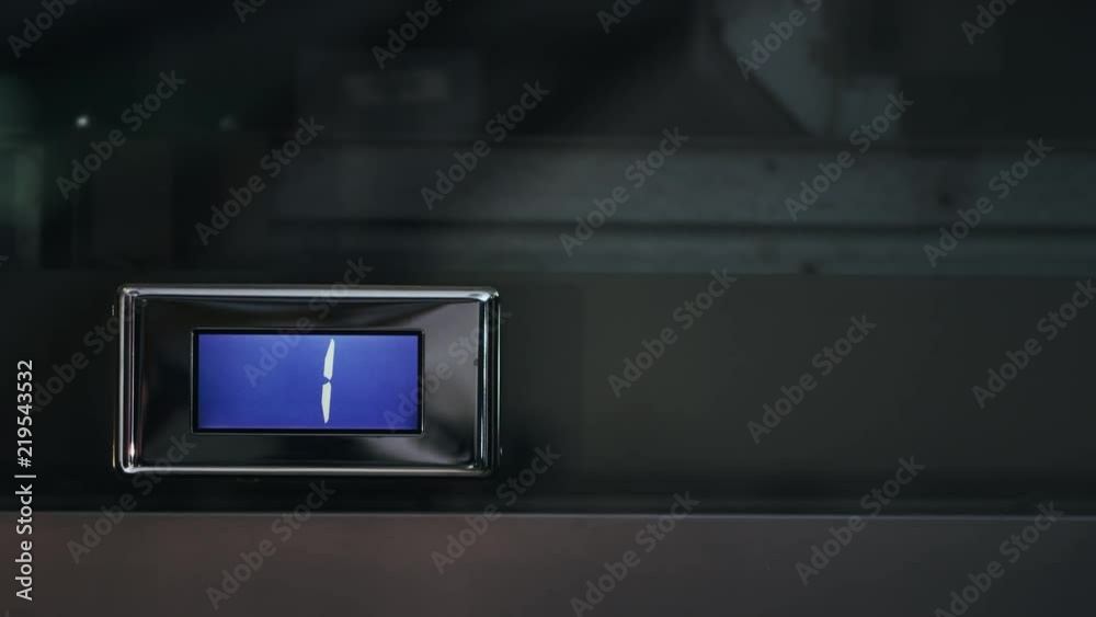 Direction indicator of electronic elevator and floor counter showing cipher one. Elevator indicator showing first floor. Lift indicator showing direction of lift movement with number of floor