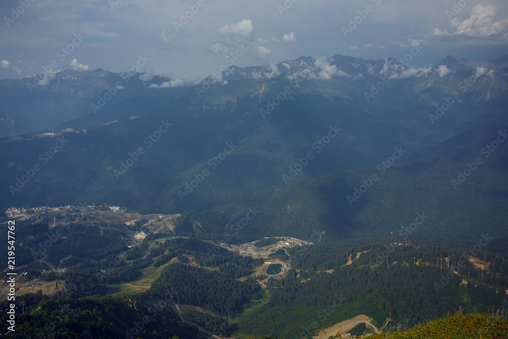 Roza Khutor Plateau Summer Alpine Ski Resort Landscape, Sochi, Russia. Close Up Of Alpine Meadow On A Background Of Caucasian Mountains