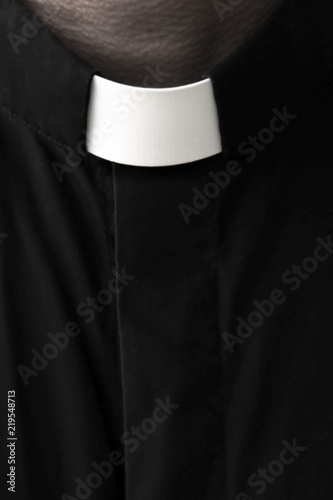 Tela Priest on a dark background. Close-up.