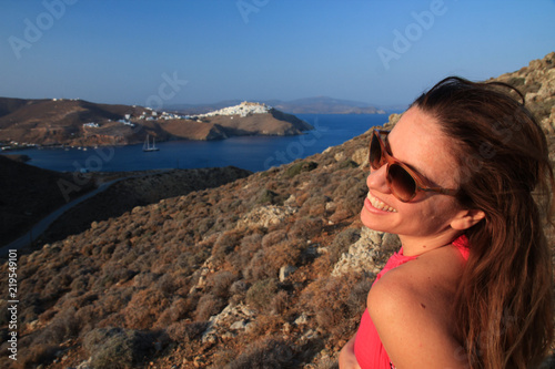 Girl in Astypalea island laughing with her head turned left