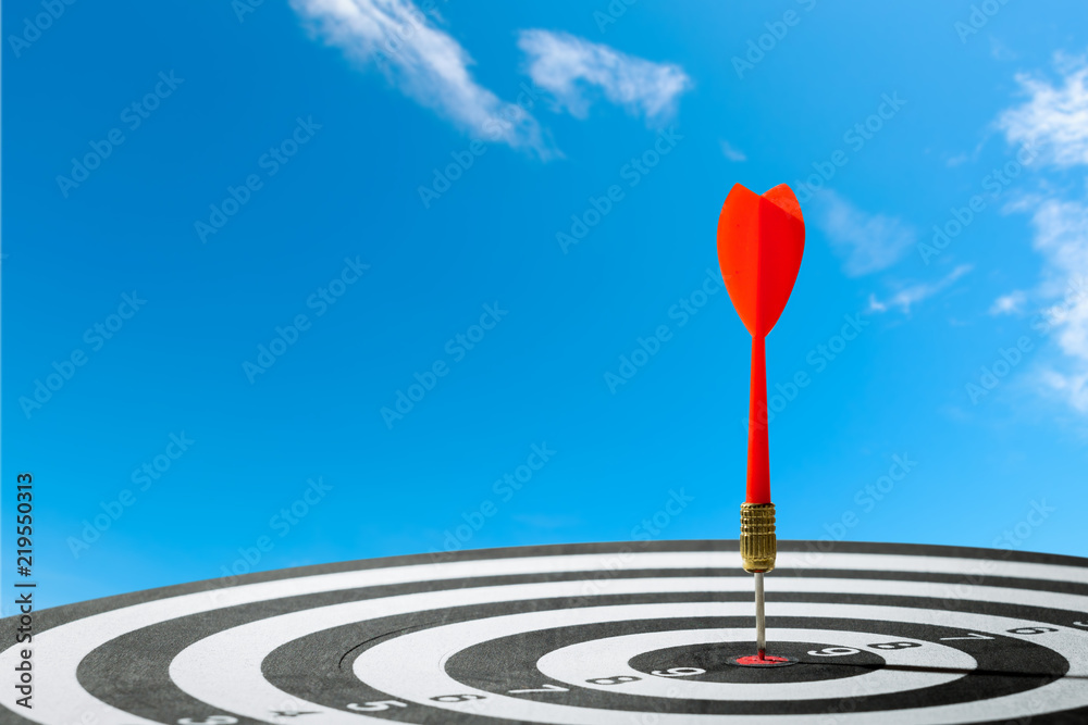 dart arrow hitting in the target center of dartboard. concept of the success dart arrow hitting in the target center of dartboard. concept of the success