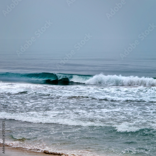 seascape image of stormy weather on beach