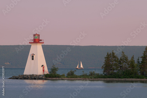 Kidston Island Lighthouse at twilight in Baddeck, Nova Scotia photo