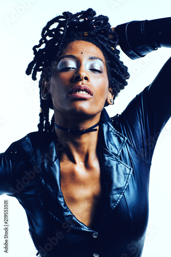 Woman with long dreadlocks and blue eyshadow, isolated on studio background photo