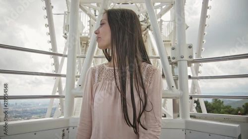 The girl on the Ferris wheel, a romantic date at altitude. Brunette with long hair