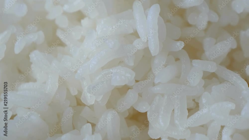 Motion video of close up steaming white rice. Motion video of close up steaming white rice.