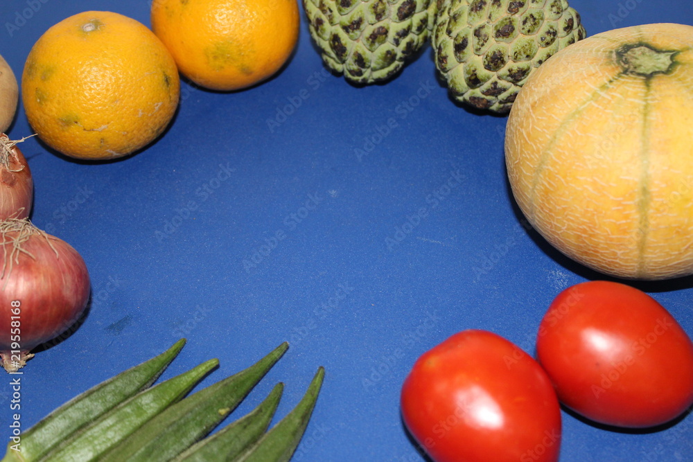 Fruits and vegetables arranges over the edges to be use as a background Fruits and vegetables arranges over the edges to be use as a background