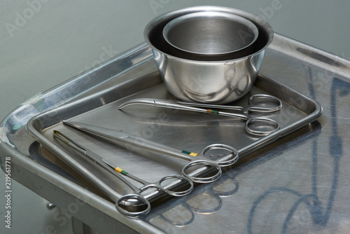 Used surgical instruments on a stainless tray