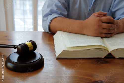 judge with gavel & legal law book at courtroom. lawyer attorney justice