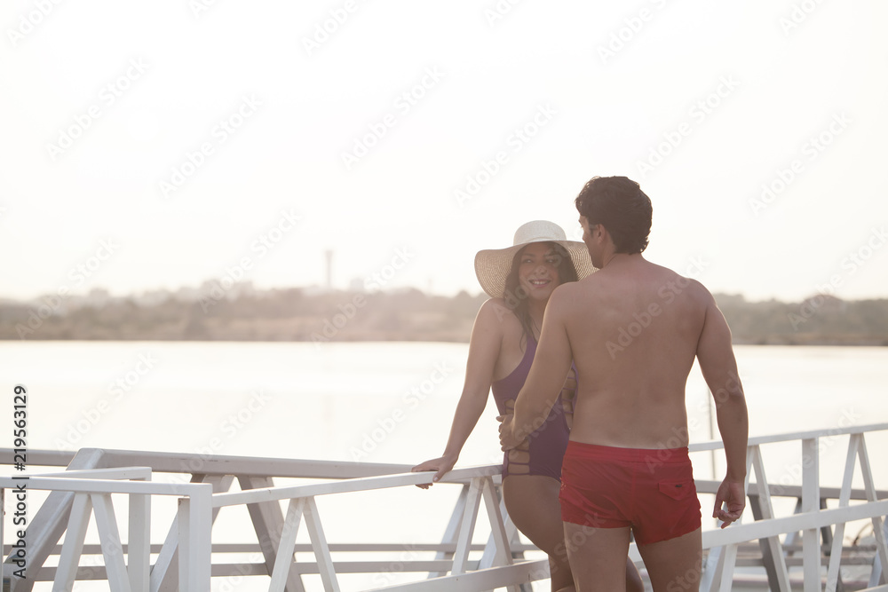 Young and handsome couple enjoying the sunset Young and handsome couple enjoying the sunset