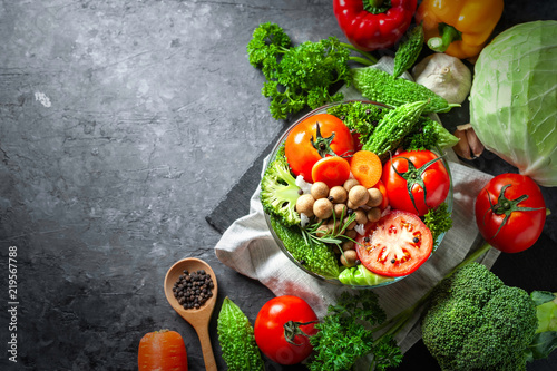 Various fresh vegetables organic food for healthy on dark rustic background with copy space for your text.