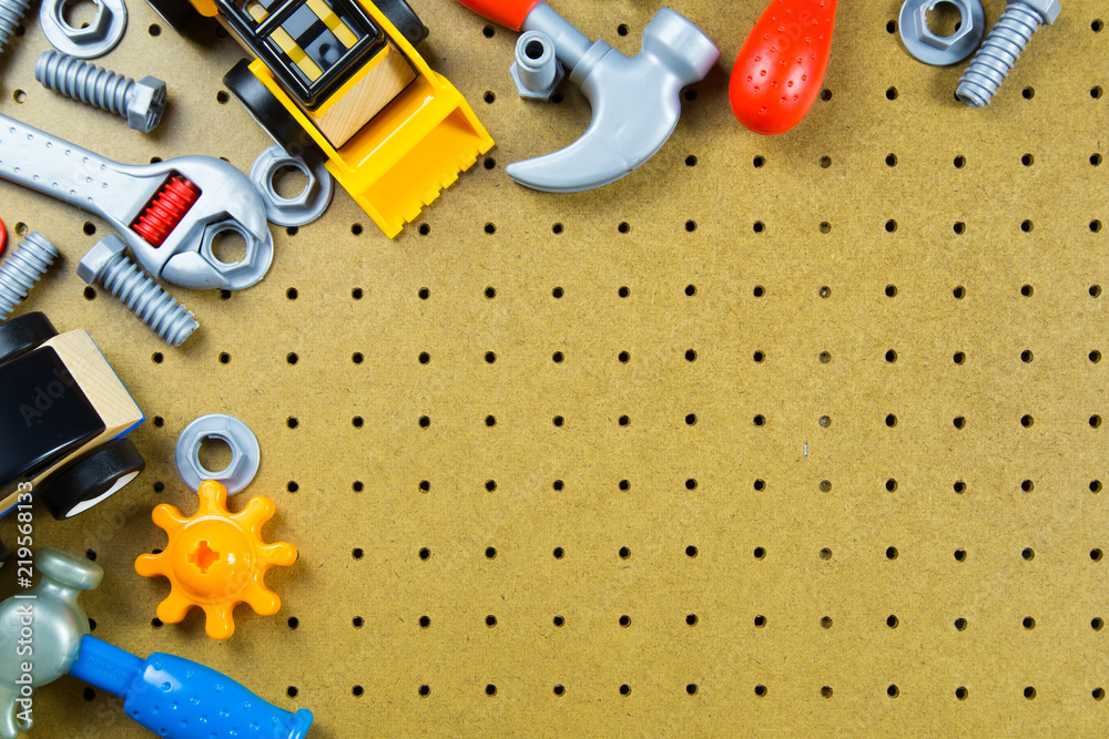 Kids construction toys tools ,Kids toys frame background. Colorful toy tools, construction blocks and car on wooden background.Top view. Copy space