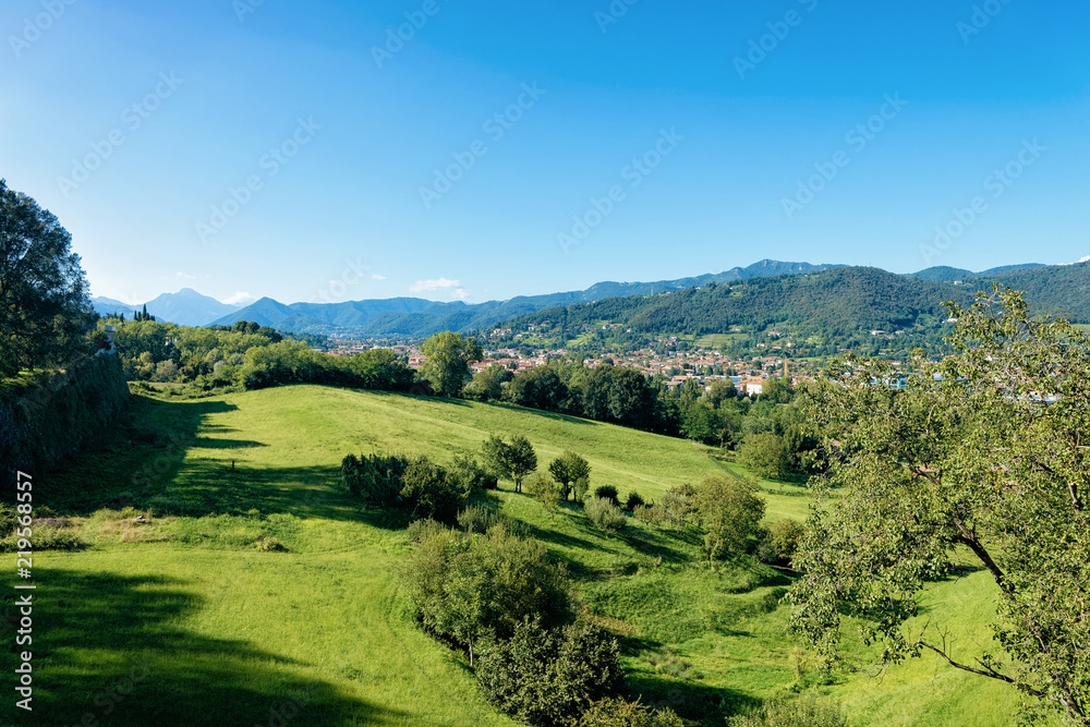 Bergamasque Alps and green hill in Bergamo Lombardy Italy