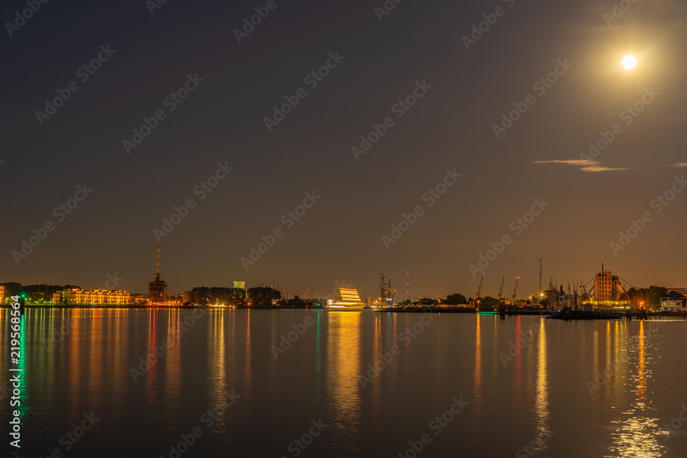 a harbor at night with light from the moon and long exposure