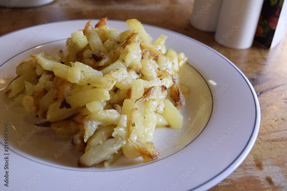 Fresh hot fried potatoes are on a plate. Traditional Belarusian, Russian food. Сlose up.