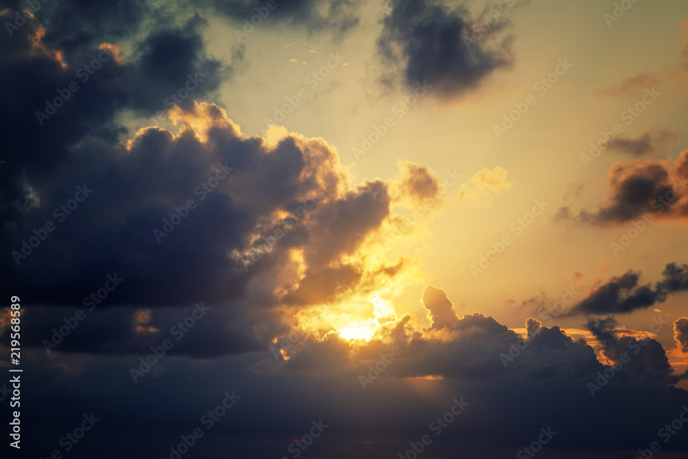 Beautiful bright dramatic sunset sky, wallpaper, natural background and texture