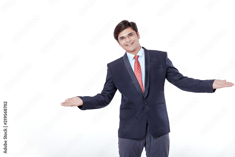 Young Indian Businessman making showing over isolated white background Young Indian Businessman making showing over isolated white background