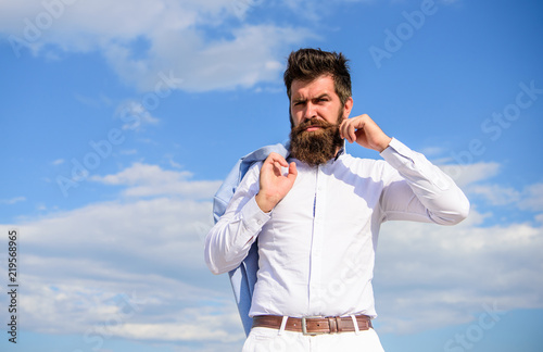 Fashionable outfit stylish appearance. Hipster with beard and mustache looks attractive fashionable white shirt. Man bearded hipster white formal clothes looks sharp sky background. Fancy groom