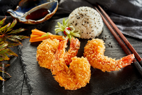 Three prawn tails fried in crispy tempura batter