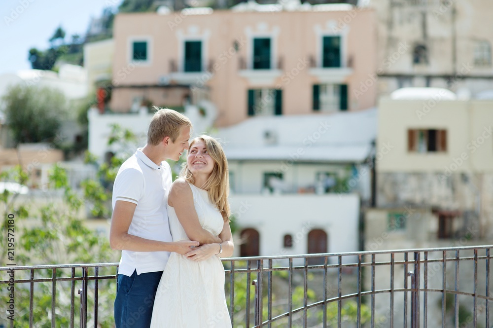 Young smiling tender romantic couple in Positano, Italy