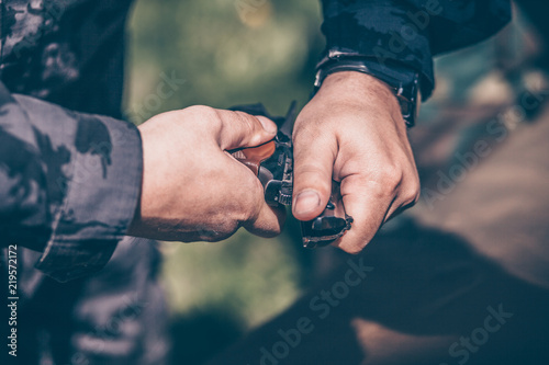 The instructor shows how to disassemble and assemble a Makarov pistol