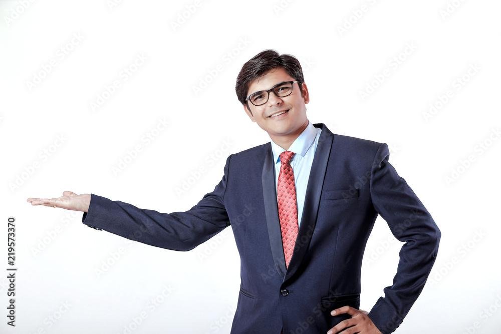 Young Indian Businessman making showing over isolated white background Young Indian Businessman making showing over isolated white background