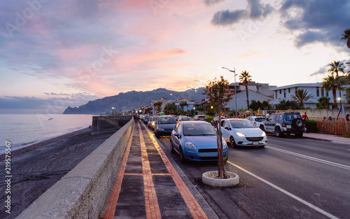 Road with cars at beach Santa Teresa di Riva Silicy photo