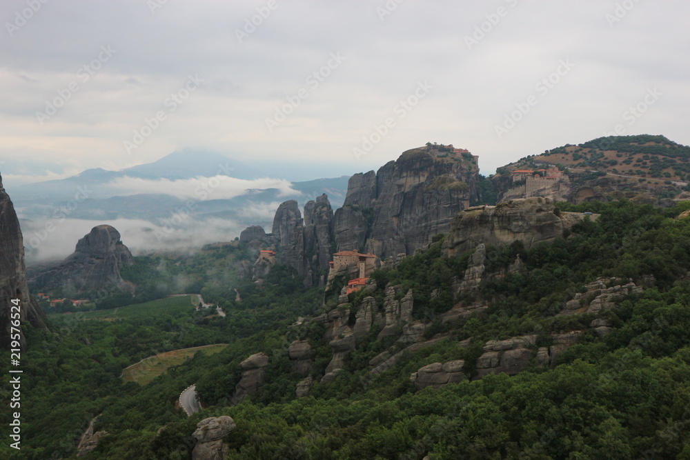 Morning view to famous Meteora valley and monastery in the clouds, Thessaly, Greece
