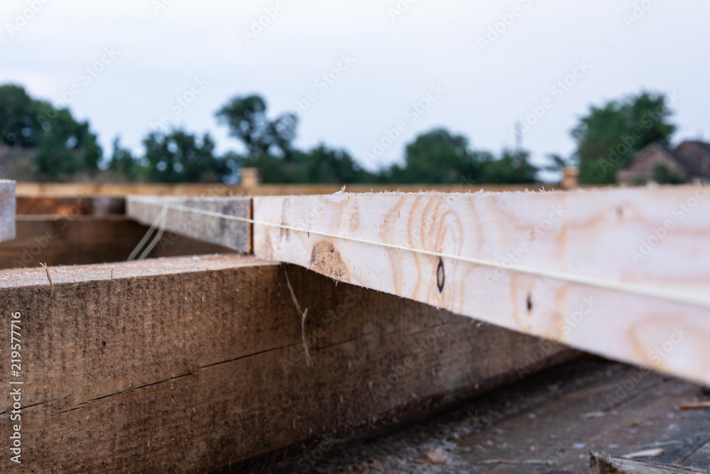Details of the frame house construction. Alignment of beams, selective focus, shallow depth of field