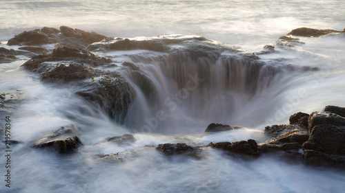 Silky smooth water floating into a hole in Pacific Ocean - Thor's well, Oregon.